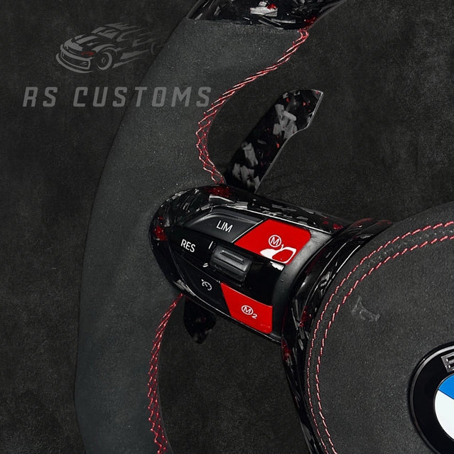 RS Customs BMW F-Series custom steering wheel with forged carbon fiber, customizable colored flakes, Alcantara grips, integrated LED display, optional heating and paddle shifters.