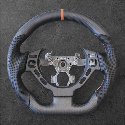 NISSAN R35 Matt Carbon / Perforert Skinn m/ Oransje Detaljer