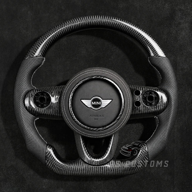 Custom MINI Cooper carbon fiber steering wheel for F54 F55 F56 F57 F60 with glossy carbon fiber top and bottom, perforated leather grips and sporty OEM+ design.