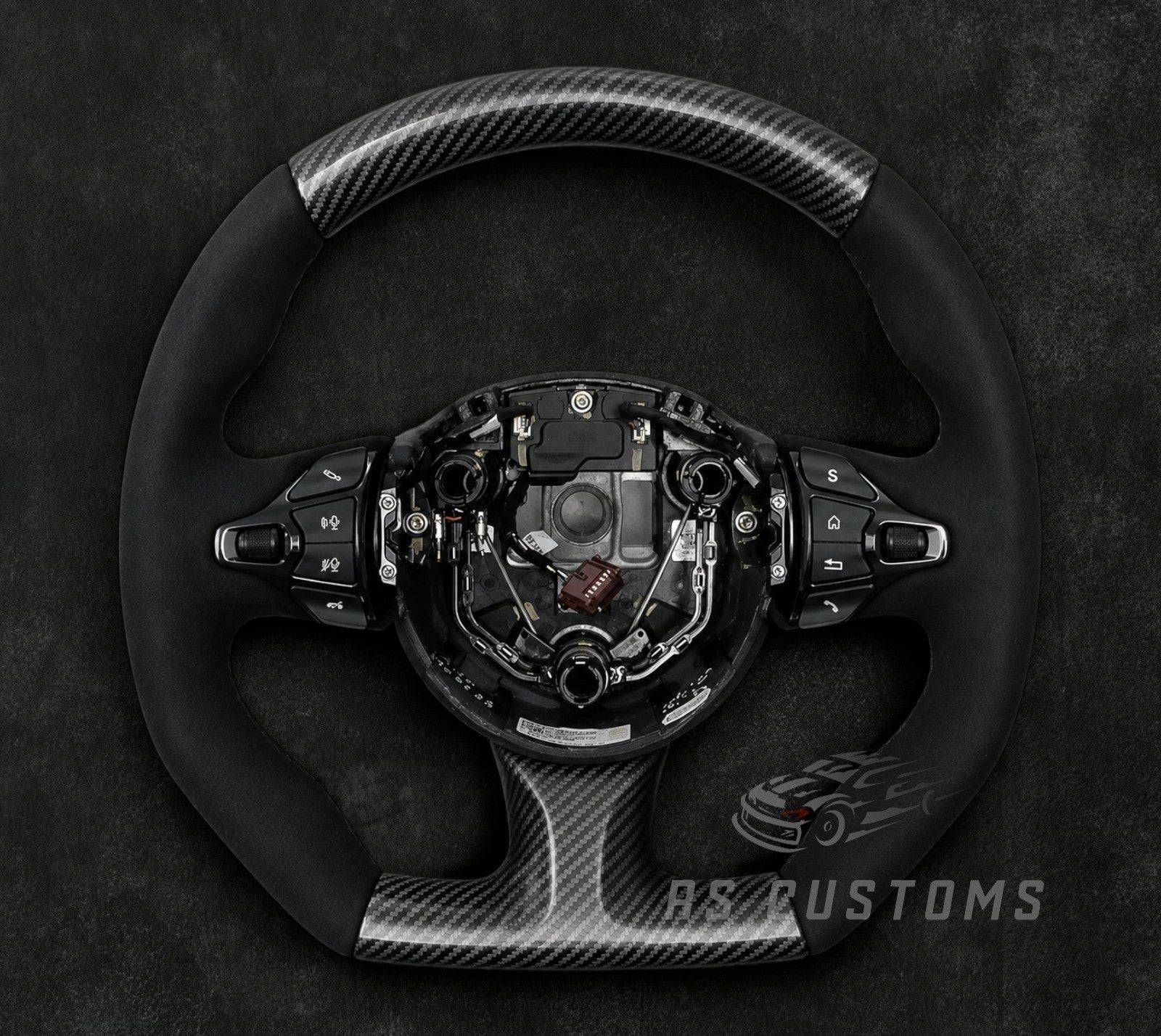 RS CUSTOMS Aston Martin carbon fiber and Alcantara steering wheel with flat top and bottom, Vulcan style.