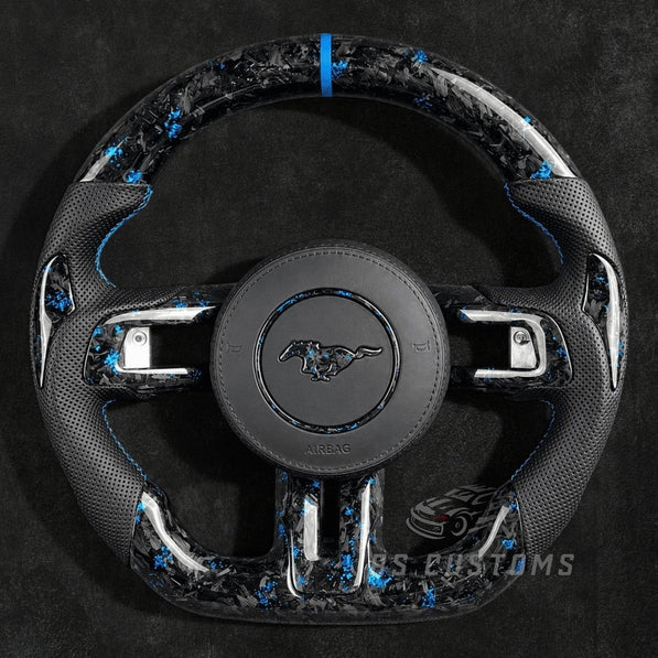 RS Customs 2015–2023 Ford Mustang custom flaked forged carbon fiber custom steering wheel with perforated leather grips and custom airbag cover with forged carbon logo.