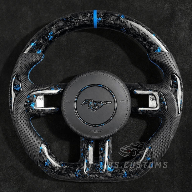 RS Customs 2015–2023 Ford Mustang custom flaked forged carbon fiber custom steering wheel with perforated leather grips and custom airbag cover with forged carbon logo.