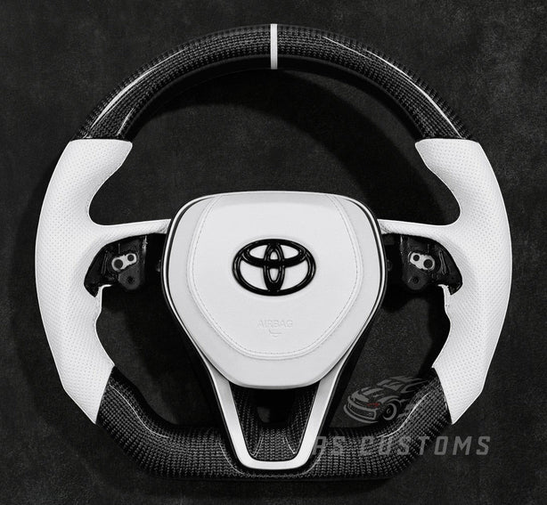 RS Customs 2018+ Toyota Corolla and Camry carbon fiber custom steering wheel with white leather grips and optional custom airbag cover in OEM+ sporty design.