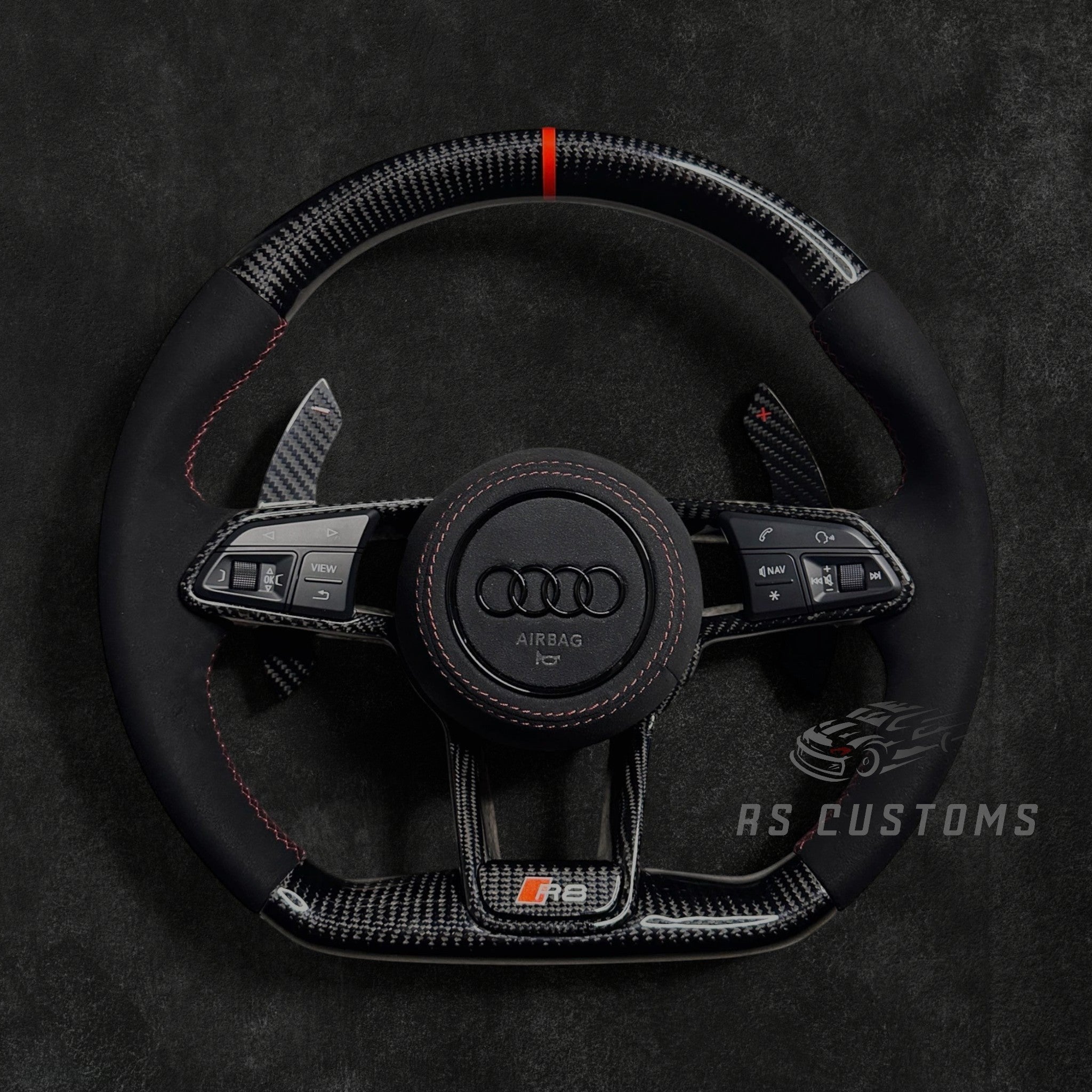 RS Customs Audi R8 and TT custom steering wheel with carbon fiber construction, Alcantara grips, carbon fiber trim, optional complete airbag and OEM functionality for Audi performance models.