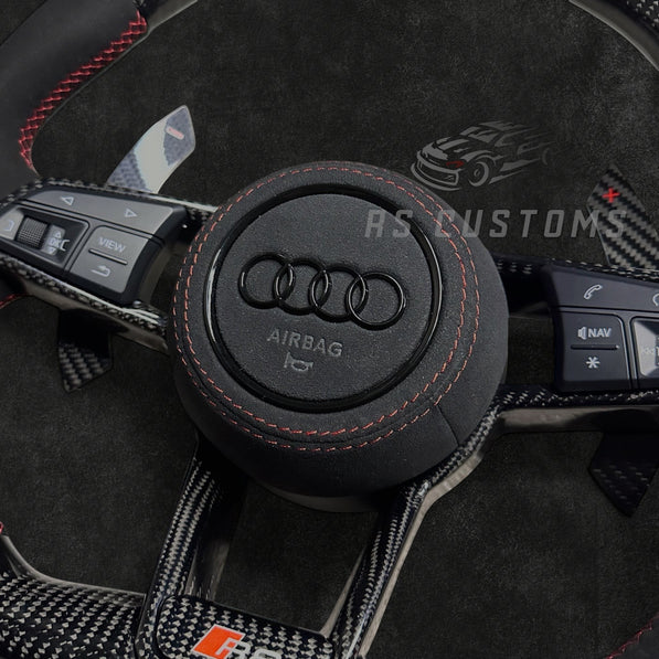 RS Customs Audi R8 and TT custom steering wheel with carbon fiber construction, Alcantara grips, carbon fiber trim, optional complete airbag and OEM functionality for Audi performance models.