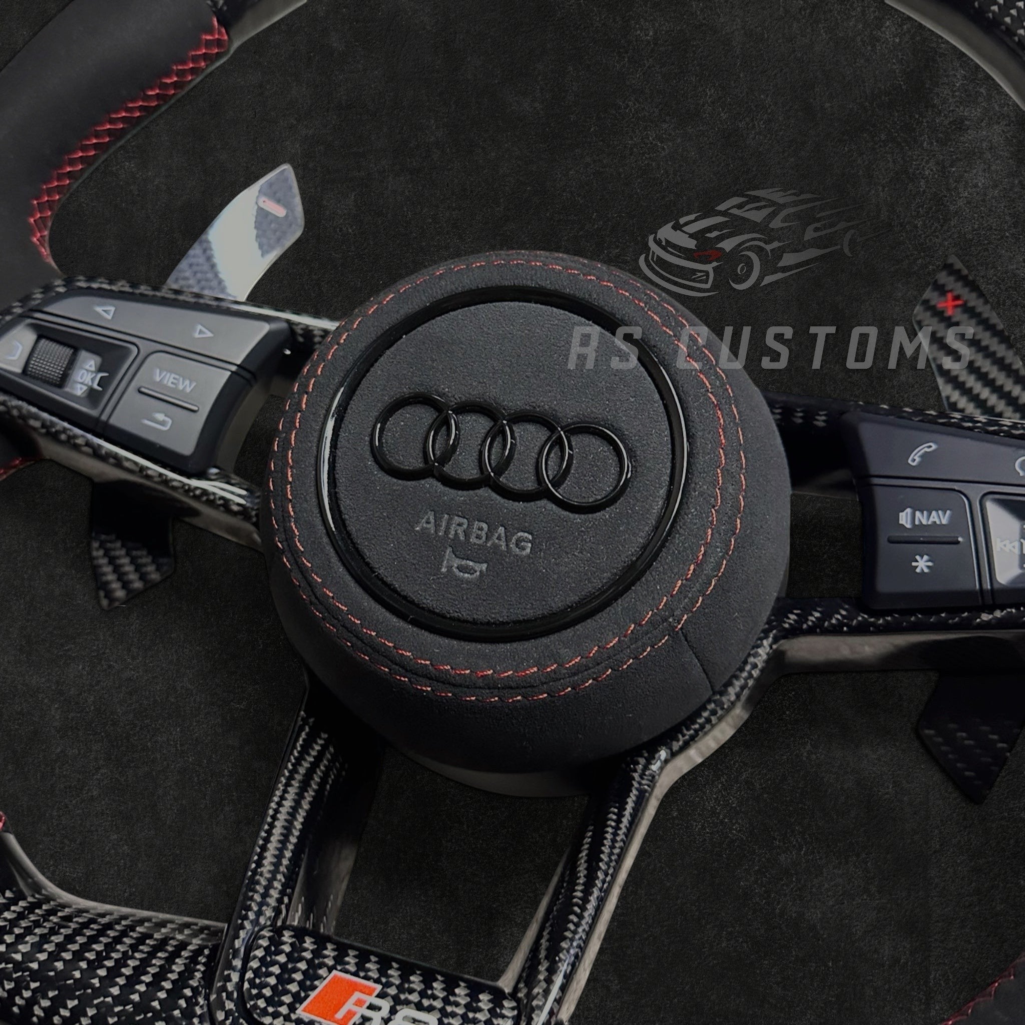 RS Customs Audi R8 and TT custom steering wheel with carbon fiber construction, Alcantara grips, carbon fiber trim, optional complete airbag and OEM functionality for Audi performance models.