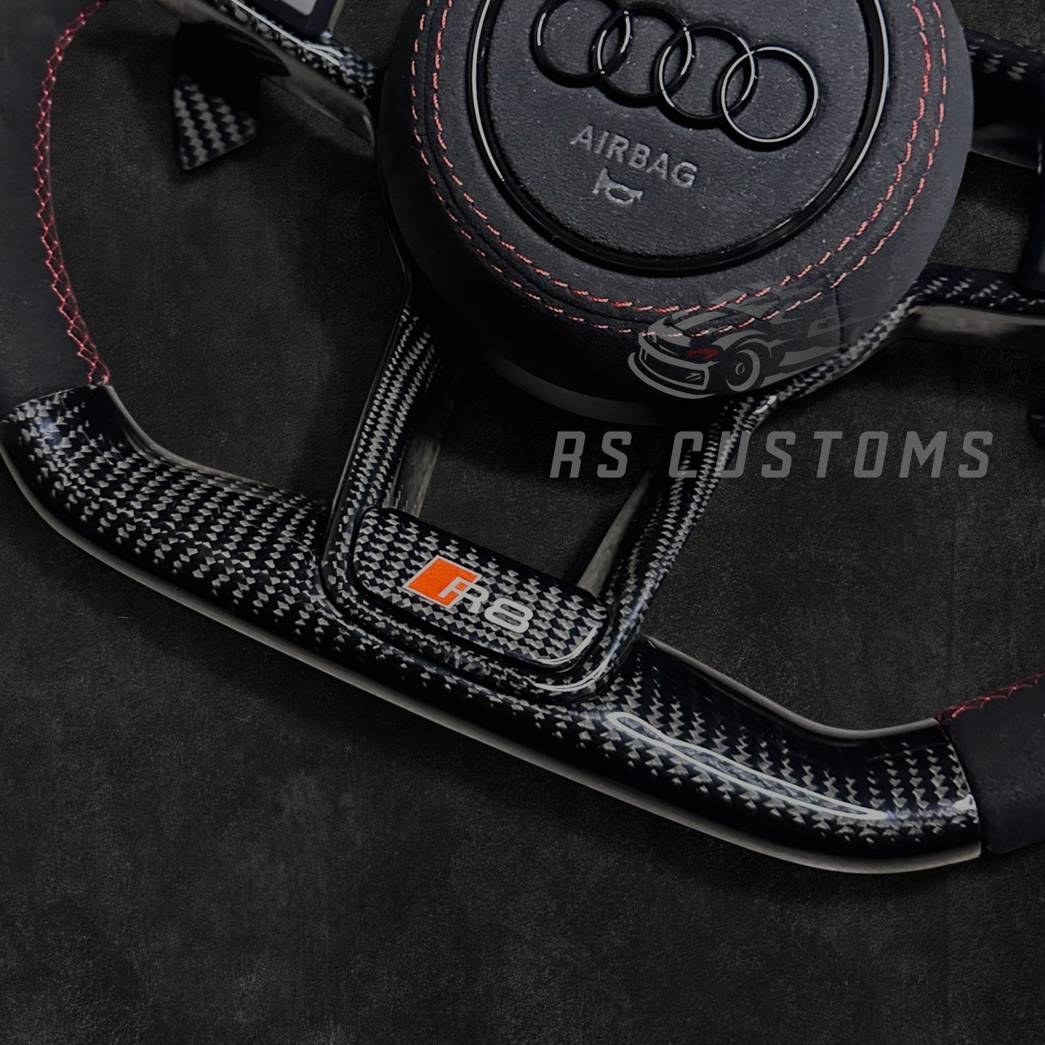 RS Customs Audi R8 and TT custom steering wheel with carbon fiber construction, Alcantara grips, carbon fiber trim, optional complete airbag and OEM functionality for Audi performance models.