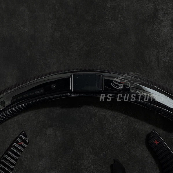 RS Customs Audi R8 TT TTS TT RS custom steering wheel with carbon fiber, Alcantara grips, LED display and black trim details compatible with Audi models from 2014+.
