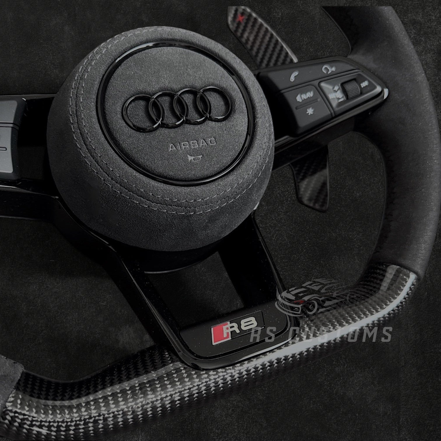 RS Customs Audi R8 TT TTS TT RS custom steering wheel with carbon fiber, Alcantara grips, LED display and black trim details compatible with Audi models from 2014+.