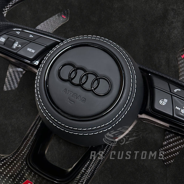 RS Customs Audi RS B9 custom steering wheel with carbon fiber, leather grips, custom center stripe and chrome delete trim for RS3, RS4, RS5, RS6, RS7 and other Audi models.
