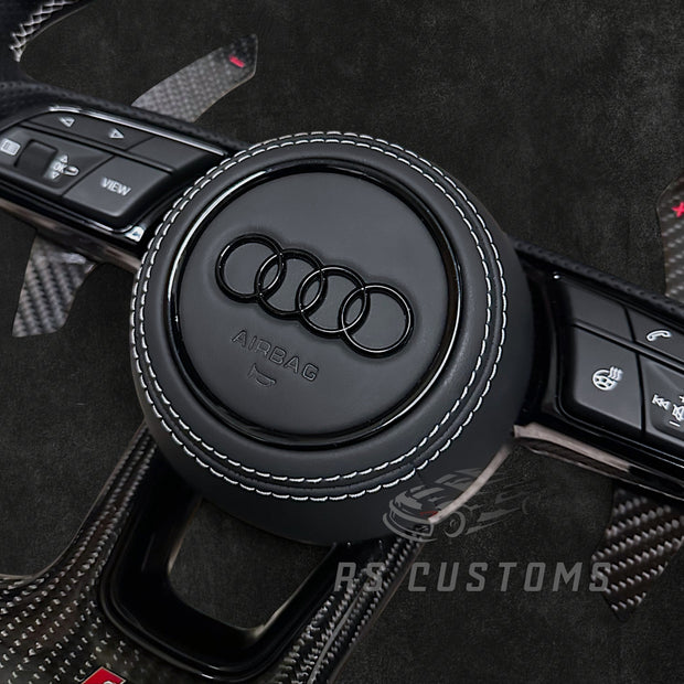 RS Customs Audi RS B9 custom steering wheel with carbon fiber, leather grips, custom center stripe and chrome delete trim for RS3, RS4, RS5, RS6, RS7 and other Audi models.