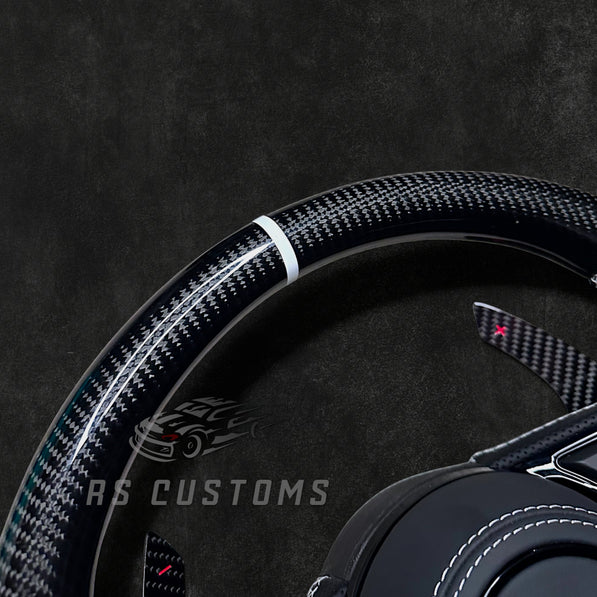 RS Customs Audi RS B9 custom steering wheel with carbon fiber, leather grips, custom center stripe and chrome delete trim for RS3, RS4, RS5, RS6, RS7 and other Audi models.
