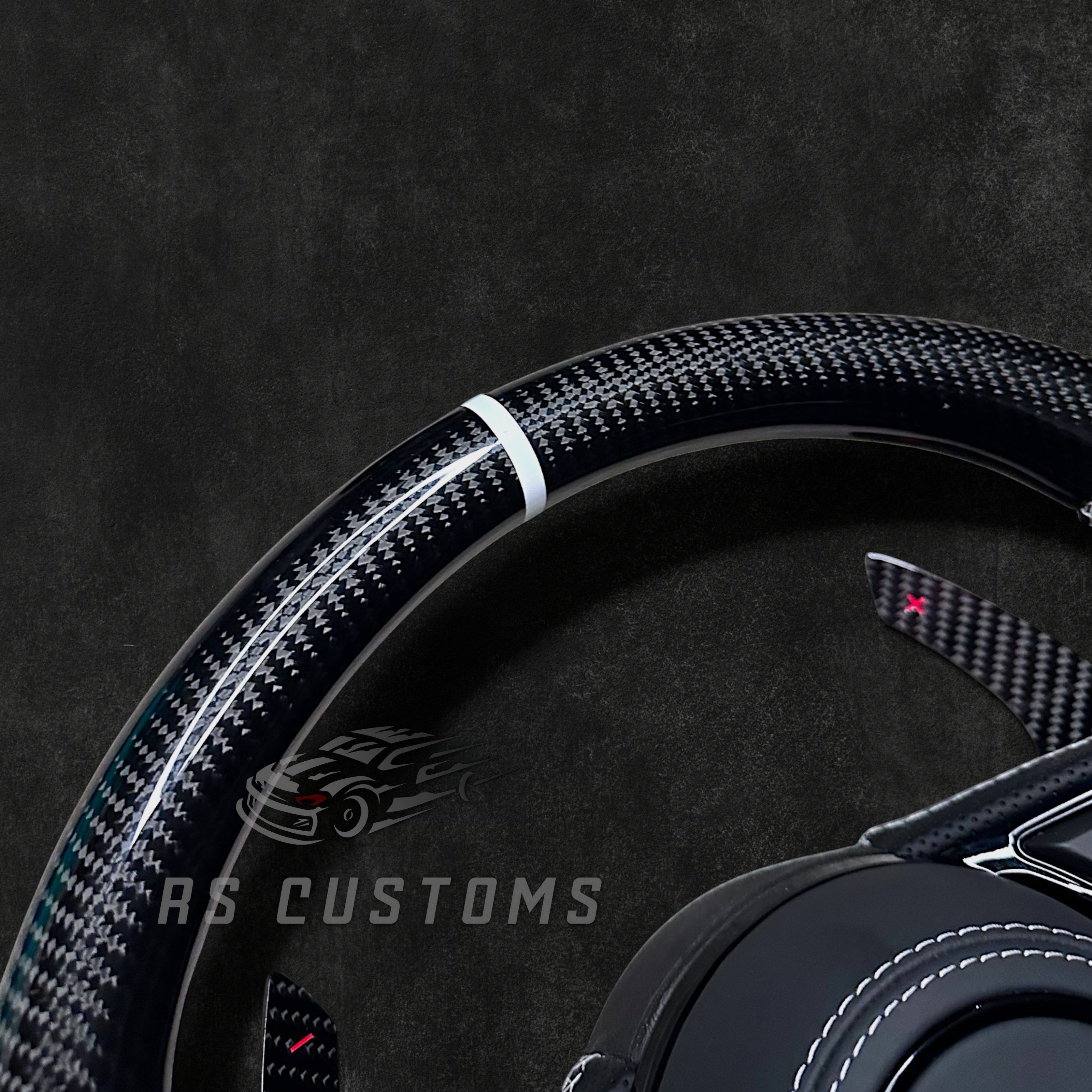 RS Customs Audi RS B9 custom steering wheel with carbon fiber, leather grips, custom center stripe and chrome delete trim for RS3, RS4, RS5, RS6, RS7 and other Audi models.