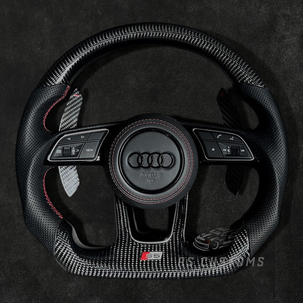RS Customs Audi RS B9-style custom steering wheel with carbon fiber, perforated leather grips and optional heating for Audi A, S, RS, Q and R models from 2012+.