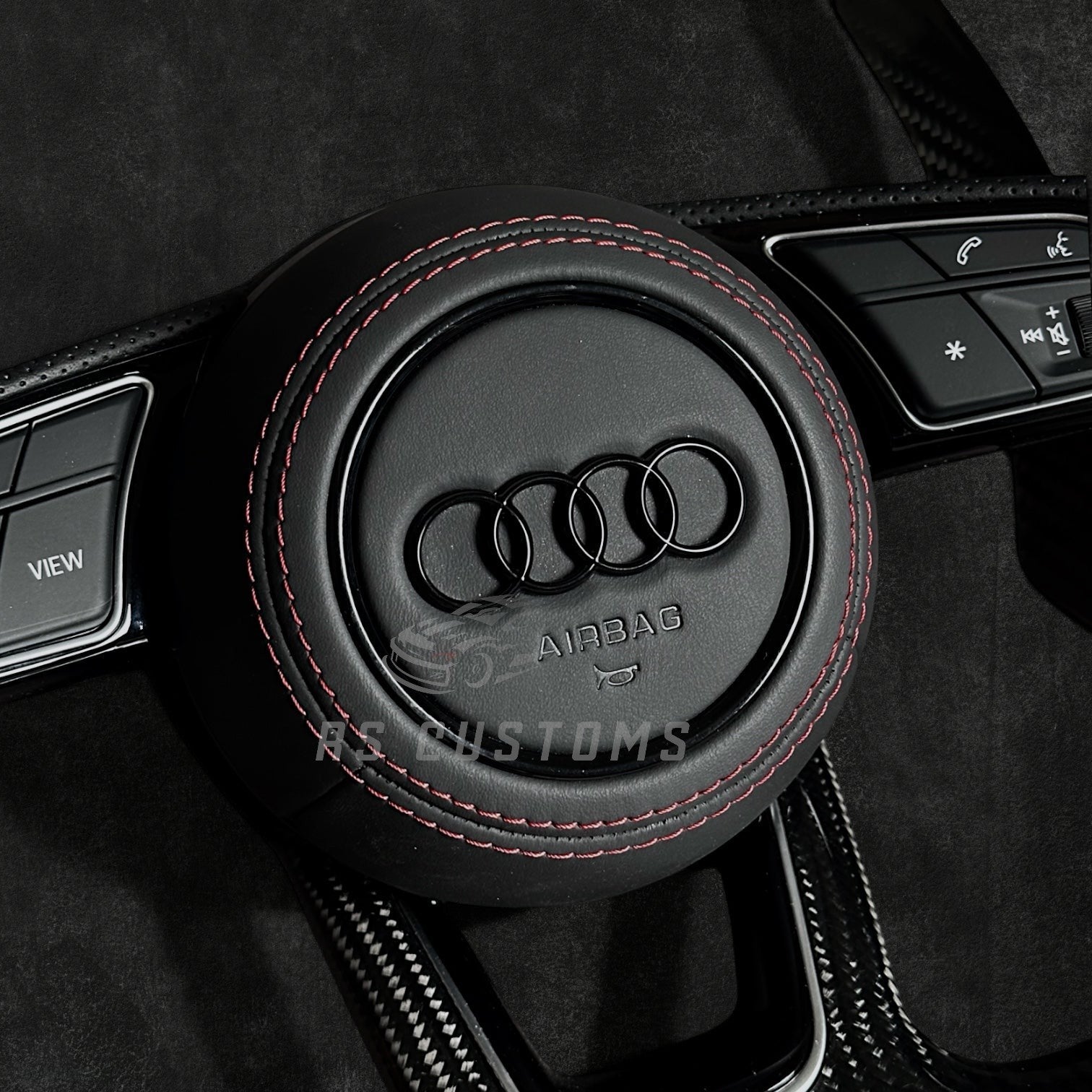 RS Customs Audi RS B9-style custom steering wheel with carbon fiber, perforated leather grips and optional heating for Audi A, S, RS, Q and R models from 2012+.