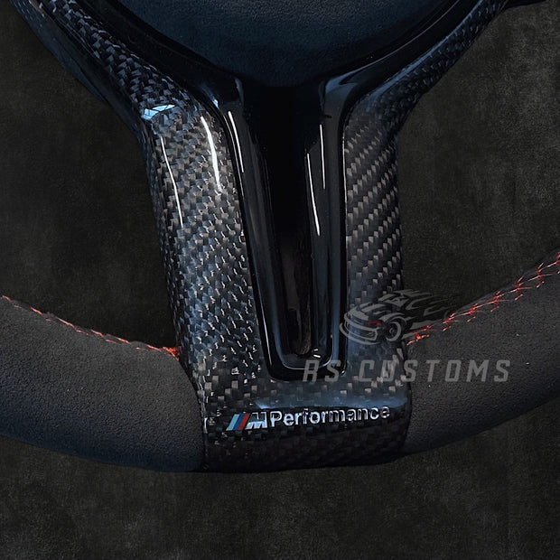 RS Customs BMW F-Series Alcantara steering wheel with carbon fiber trim, optional Alcantara airbag cover, heating support, paddle shifters and OEM+ motorsport design.