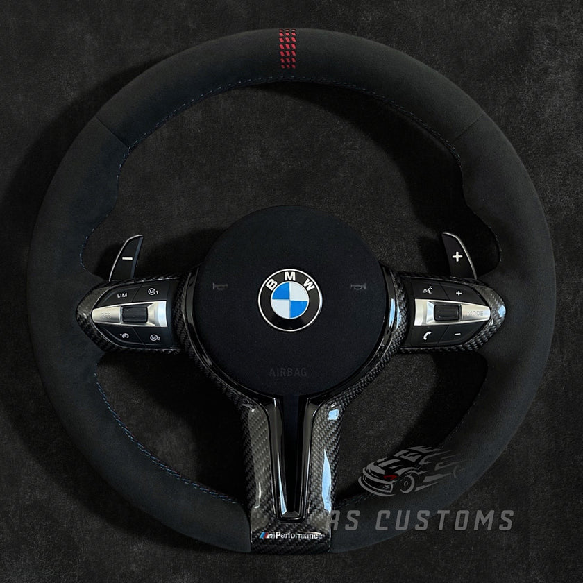 RS Customs BMW F-Series CS-style custom steering wheel with Alcantara, CS stripe, carbon fiber trim, optional Alcantara airbag cover, heating support and paddle shifter compatibility.