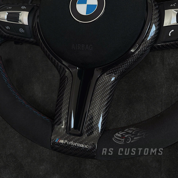 RS Customs BMW F-Series CS-style custom steering wheel with Alcantara, CS stripe, carbon fiber trim, optional Alcantara airbag cover, heating support and paddle shifter compatibility.