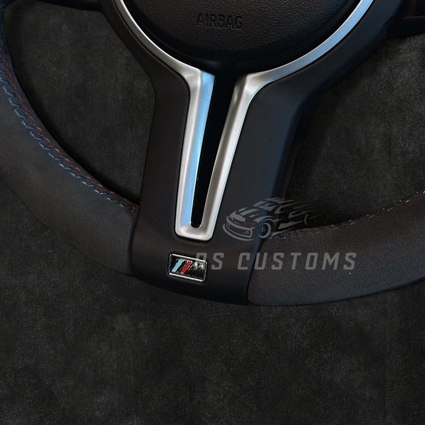 RS Customs BMW F-Series Custom Alcantara steering wheel with customizable center stripe, optional Alcantara airbag cover, heating support and paddle shifter compatibility.