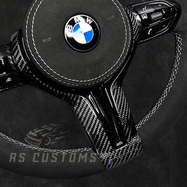 RS Customs BMW F-Series custom steering wheel with full Alcantara, carbon fiber trim, optional complete airbag assembly, multifunction buttons, heating and paddle shifters.