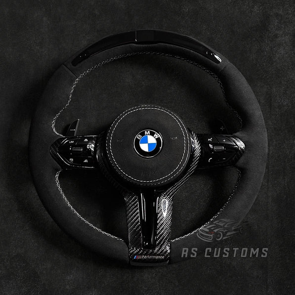 RS Customs BMW F-Series custom steering wheel with full Alcantara, carbon fiber trim, optional complete airbag assembly, multifunction buttons, heating and paddle shifters.