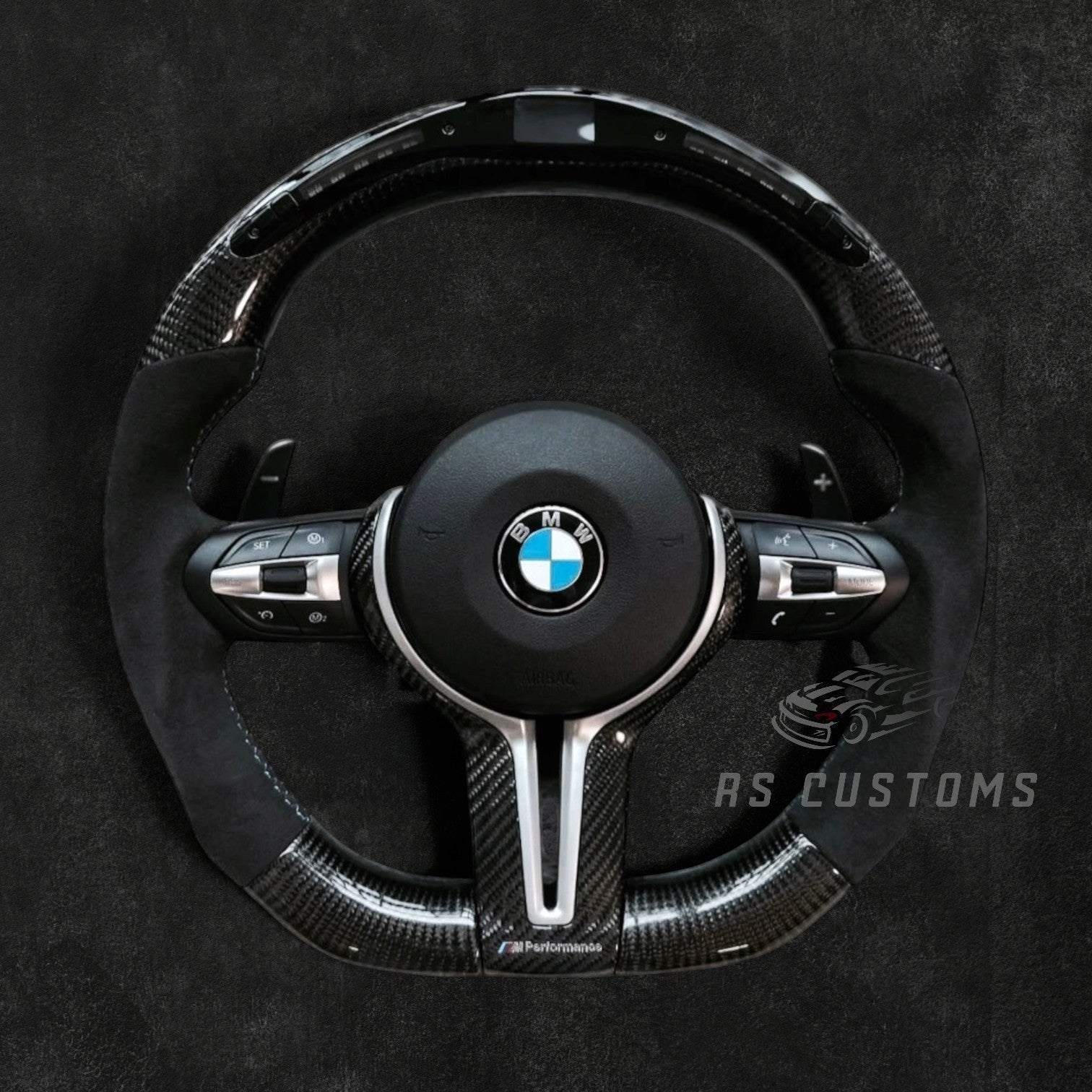 RS Customs BMW F-Series custom steering wheel with carbon fiber, Alcantara grips, integrated LED display, optional heating, paddle shifters and OEM functionality for F-Series BMW models.