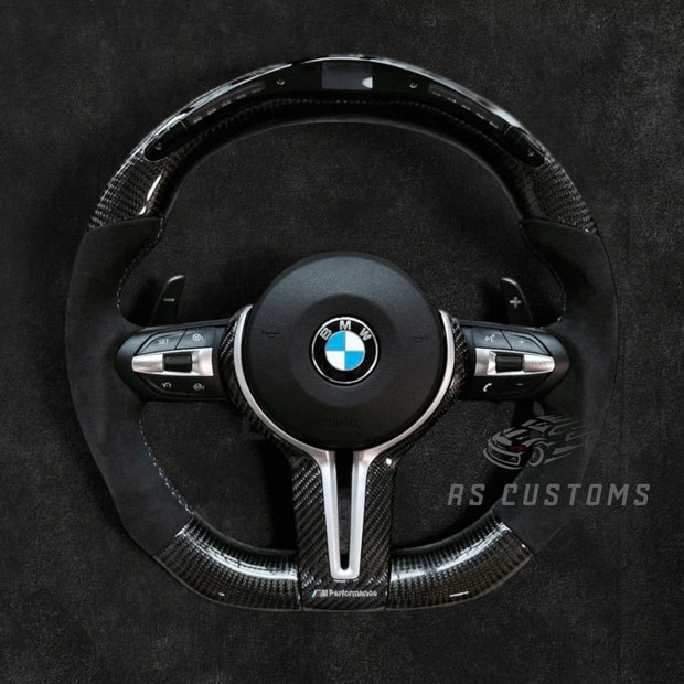 RS Customs BMW F-Series custom steering wheel with carbon fiber, Alcantara grips, integrated LED display, optional heating, paddle shifters and OEM functionality for F-Series BMW models.