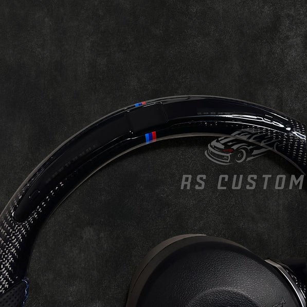 RS Customs BMW F-Series custom steering wheel with carbon fiber, leather grips, integrated LED display, optional complete airbag, multifunction buttons, heating and paddle shifters.