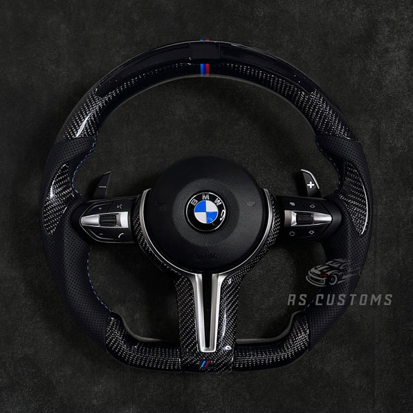 RS Customs BMW F-Series custom steering wheel with carbon fiber, leather grips, integrated LED display, optional complete airbag, multifunction buttons, heating and paddle shifters.