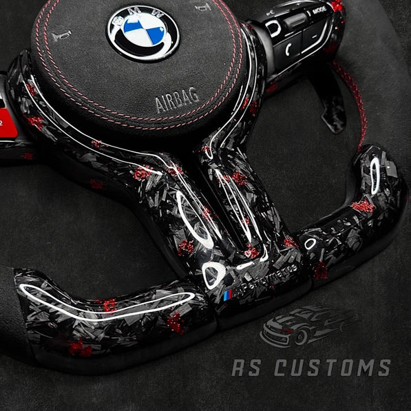 RS Customs BMW F-Series custom steering wheel with forged carbon fiber, customizable colored flakes, Alcantara grips, integrated LED display, optional heating and paddle shifters.