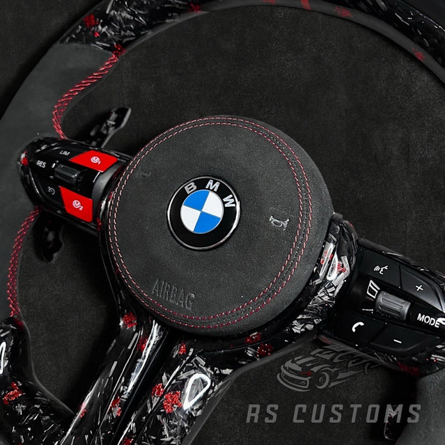 RS Customs BMW F-Series custom steering wheel with forged carbon fiber, customizable colored flakes, Alcantara grips, integrated LED display, optional heating and paddle shifters.