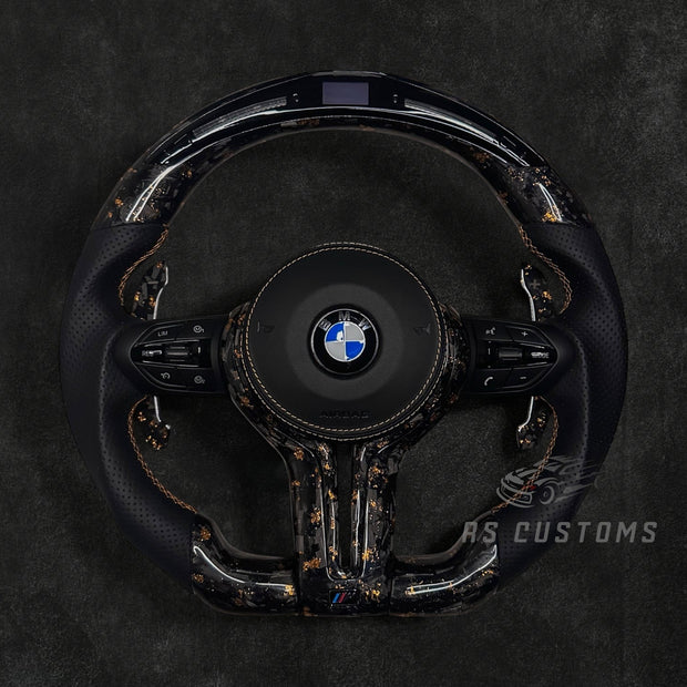 RS Customs BMW F-Series custom steering wheel with forged carbon fiber, customizable colored flakes, perforated leather grips, integrated LED display, optional complete airbag, heating and paddle shifters.