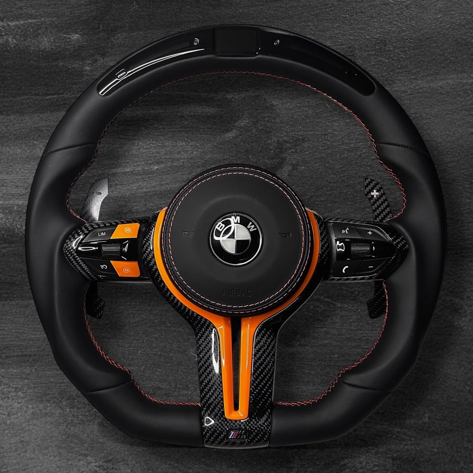 RS Customs BMW F-Series custom steering wheel with Nappa leather, carbon fiber trim, customizable colored accents, LED display, optional complete airbag, heating and paddle shifters.