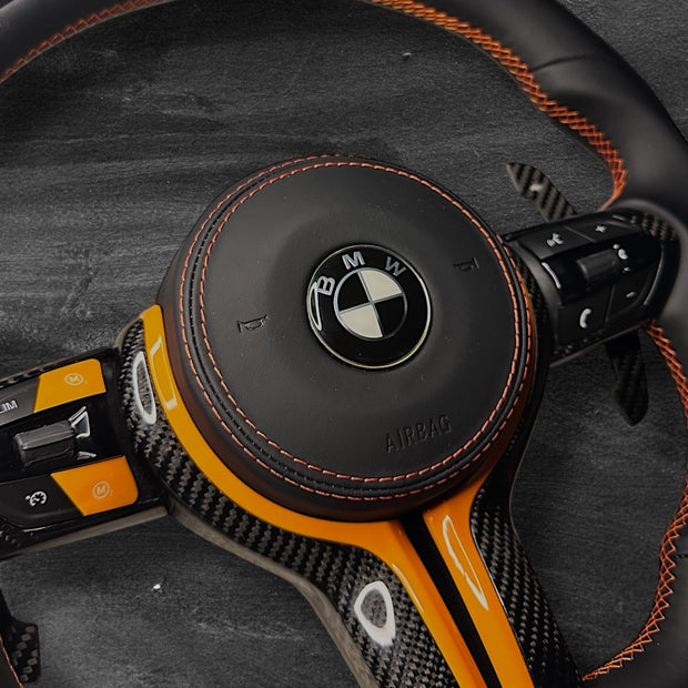 RS Customs BMW F-Series custom steering wheel with Nappa leather, carbon fiber trim, customizable colored accents, LED display, optional complete airbag, heating and paddle shifters.