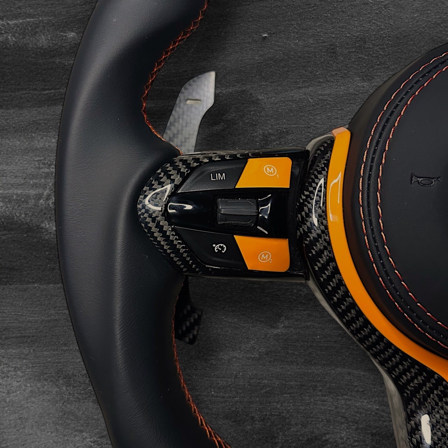 RS Customs BMW F-Series custom steering wheel with Nappa leather, carbon fiber trim, customizable colored accents, LED display, optional complete airbag, heating and paddle shifters.