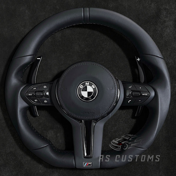 RS Customs BMW F-Series flat bottom leather steering wheel with black trim, heating, vibration support, paddle shifters and optional OEM or custom airbag.