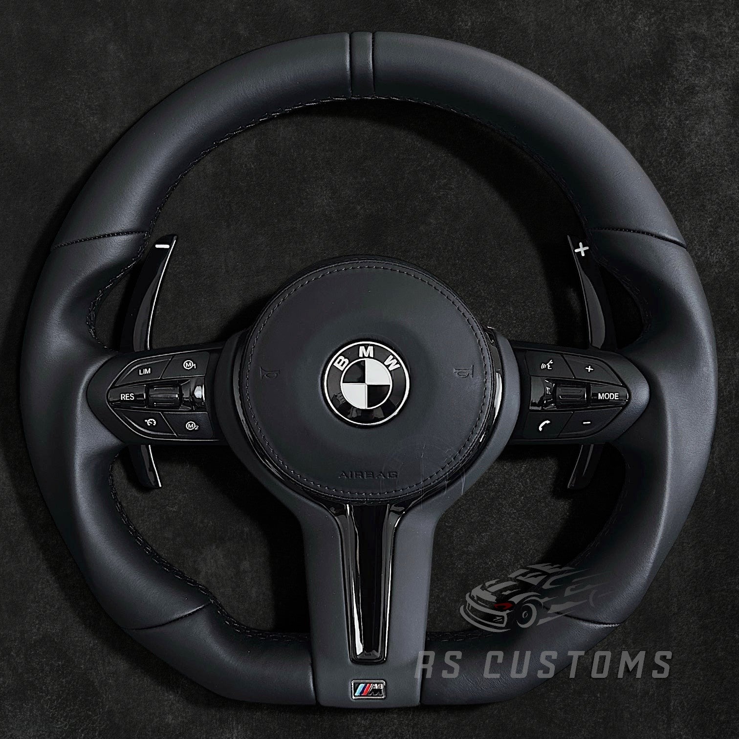 RS Customs BMW F-Series flat bottom leather steering wheel with black trim, heating, vibration support, paddle shifters and optional OEM or custom airbag.