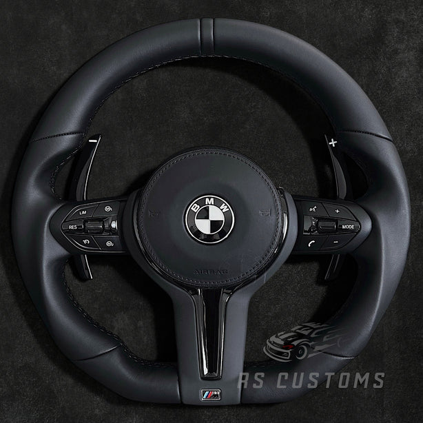 RS Customs BMW F-Series flat bottom leather steering wheel with black trim, heating, vibration support, paddle shifters and optional OEM or custom airbag.