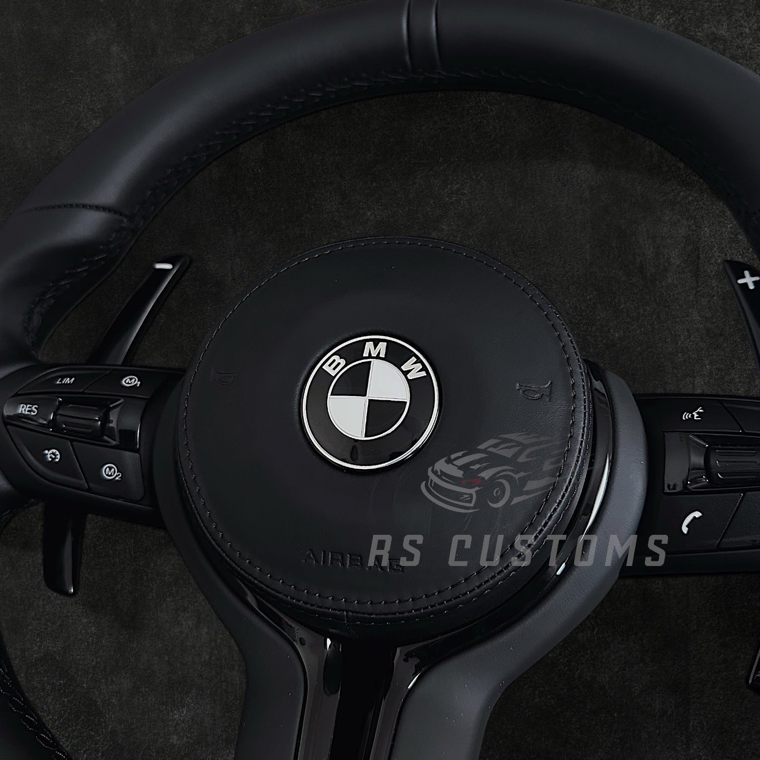 RS Customs BMW F-Series flat bottom leather steering wheel with black trim, heating, vibration support, paddle shifters and optional OEM or custom airbag.