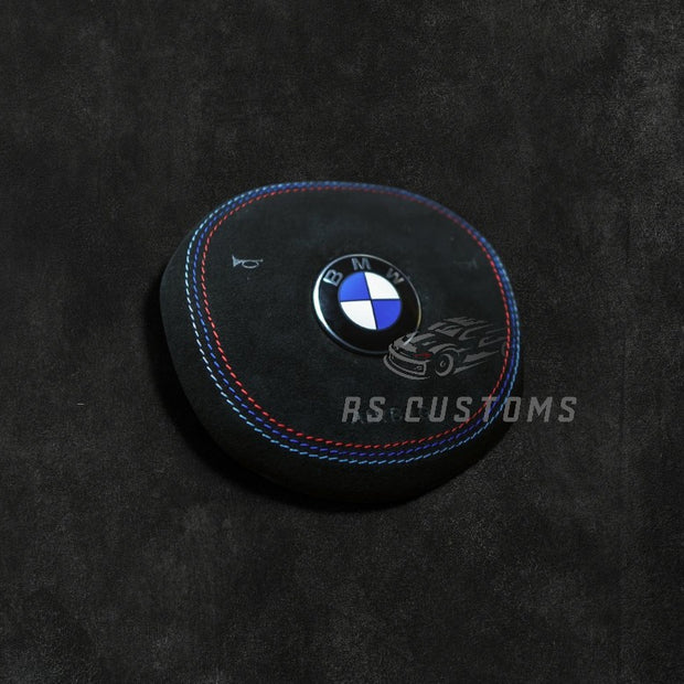 RS Customs BMW G-Series custom airbag cover for G20, G80, G82, G05, G07, G90 and other BMW G-Series models with leather, Alcantara, custom stitching and carbon fiber options.