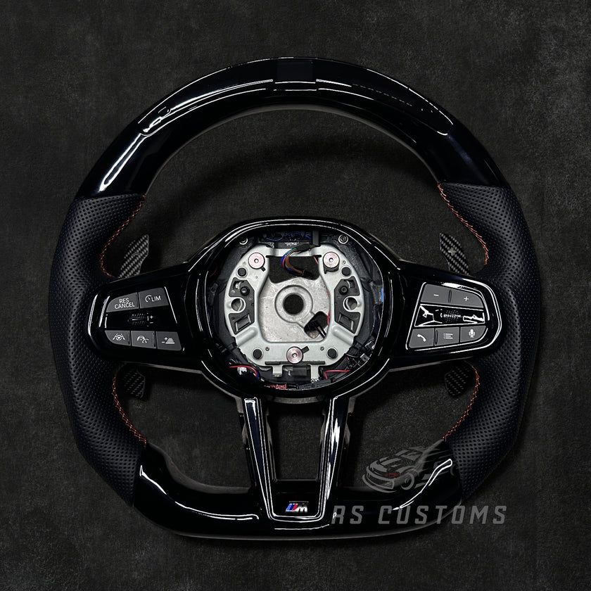RS Customs BMW G-Series custom steering wheel with Piano Black trim, perforated leather grips, LED display, heating, ACC support, HOD sensor, vibration motor, paddle shifters and optional custom airbag.