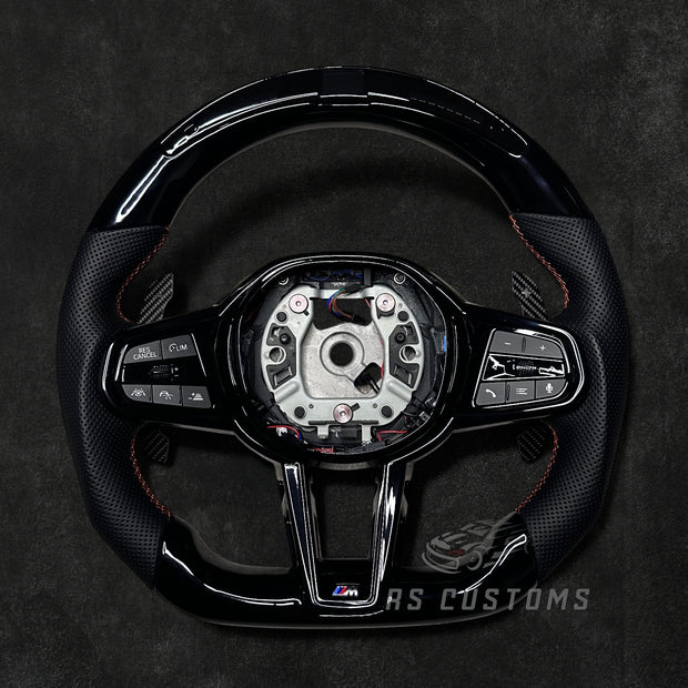 RS Customs BMW G-Series custom steering wheel with Piano Black trim, perforated leather grips, LED display, heating, ACC support, HOD sensor, vibration motor, paddle shifters and optional custom airbag.
