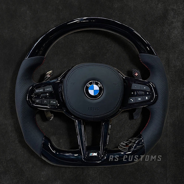 RS Customs BMW G-Series custom steering wheel with Piano Black trim, perforated leather grips, heating, ACC support, HOD sensor, vibration motor, paddle shifters and optional custom airbag.