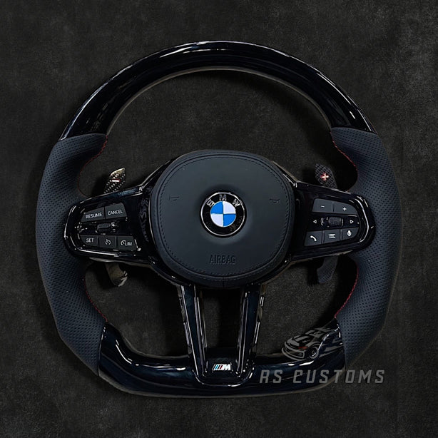 RS Customs BMW G-Series custom steering wheel with Piano Black trim, perforated leather grips, heating, ACC support, HOD sensor, vibration motor, paddle shifters and optional custom airbag.