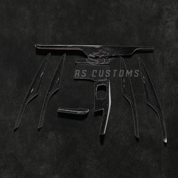 RS Customs BMW G30 5 Series 9-piece carbon fiber interior trim kit for LHD models featuring real carbon fiber moulding covers installed over original interior trim panels.