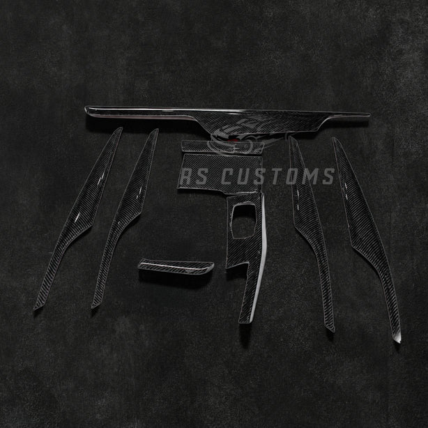 RS Customs BMW G30 5 Series 9-piece carbon fiber interior trim kit for LHD models featuring real carbon fiber moulding covers installed over original interior trim panels.
