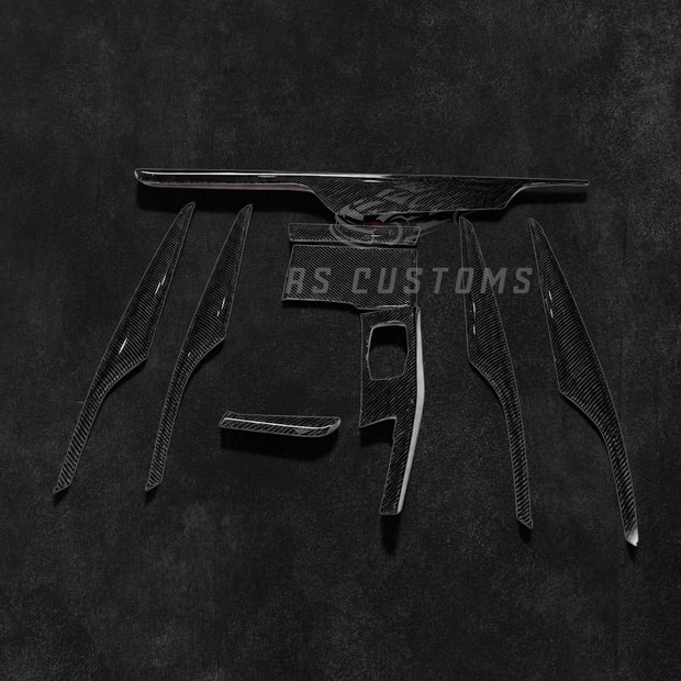 RS Customs BMW G30 5 Series 9-piece carbon fiber interior trim kit for LHD models featuring real carbon fiber moulding covers installed over original interior trim panels.