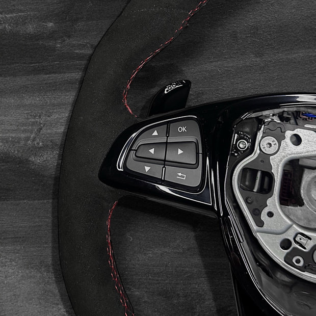 RS Customs Mercedes-AMG custom steering wheel with full Alcantara finish, gloss black trim, multifunction buttons and optional complete airbag assembly for Mercedes-Benz models from 2014+.