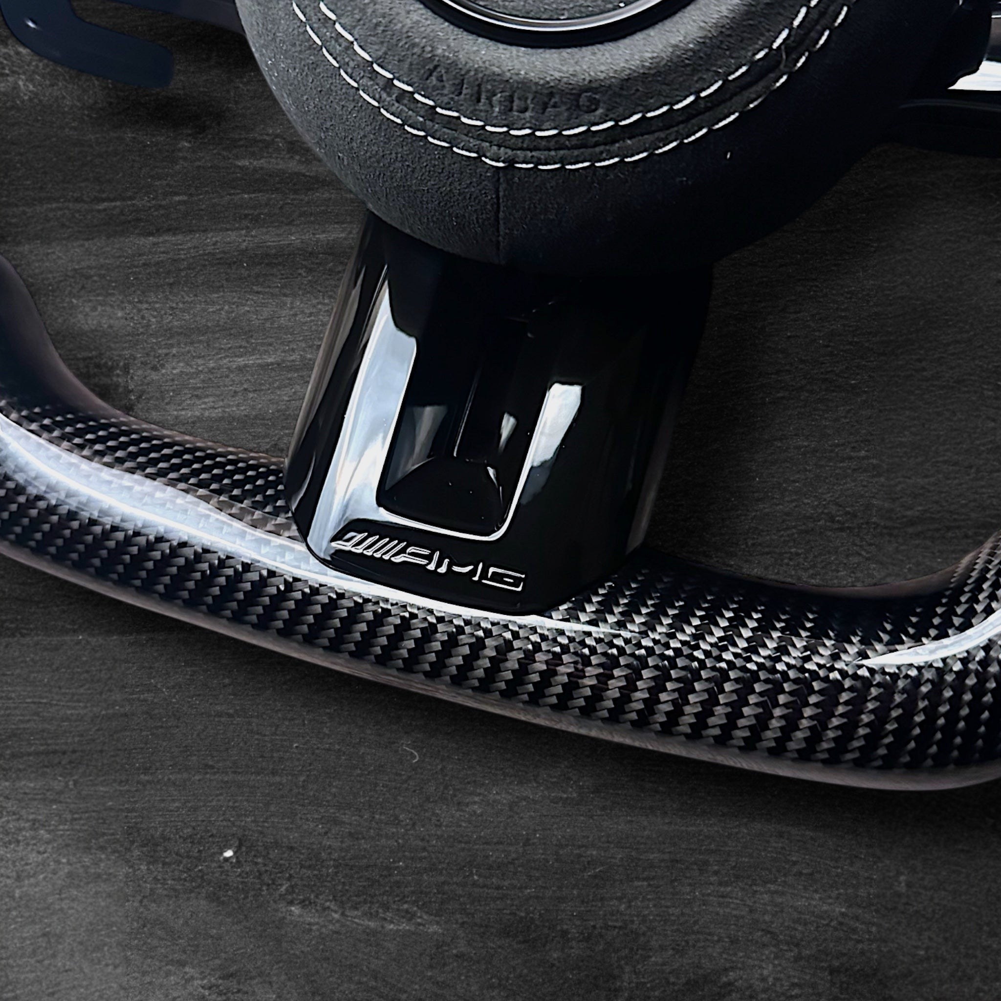 RS Customs Mercedes-AMG Dragonfly custom steering wheel with carbon fiber, Alcantara grips, multifunction buttons, optional complete airbag assembly and OEM functionality for Mercedes-Benz models from 2014+.