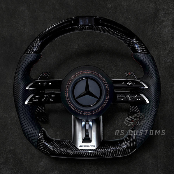 RS Customs Mercedes-AMG Dragonfly custom steering wheel with carbon fiber, perforated leather grips, LED display, multifunction buttons and optional full airbag for Mercedes-Benz models from 2014+.